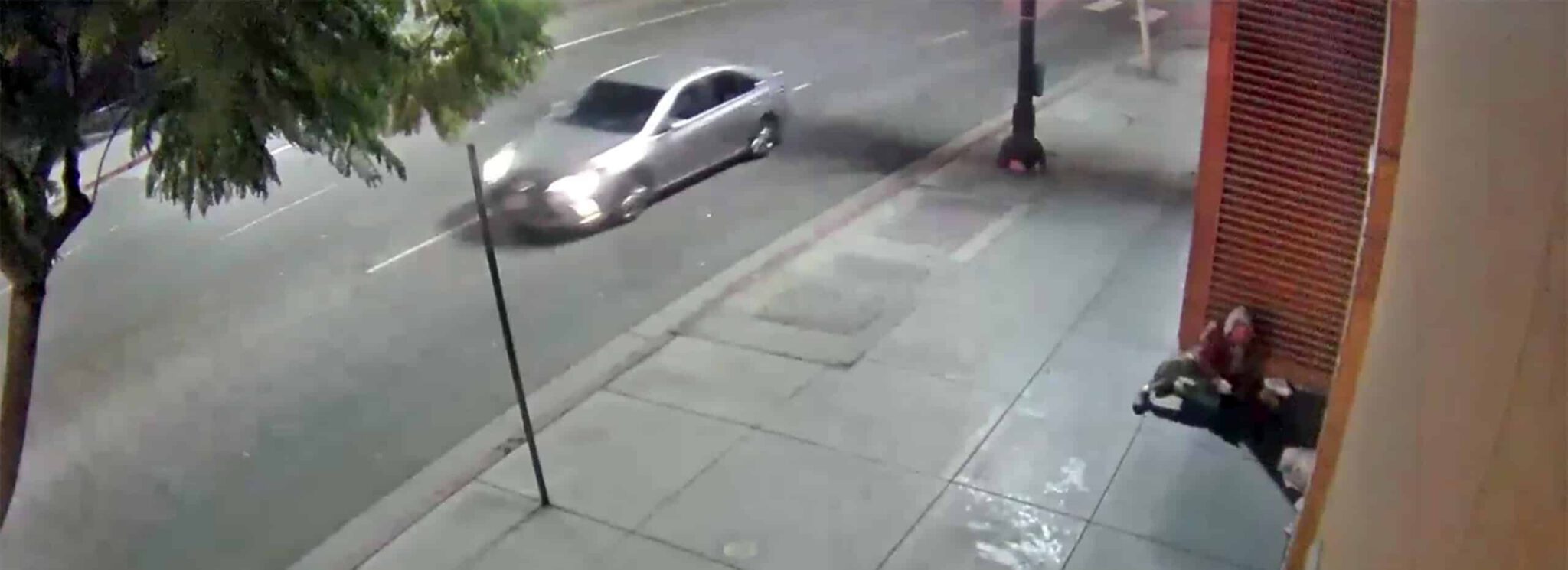 Homeless Sleeping on Apartment Sidewalk hero scaled 1