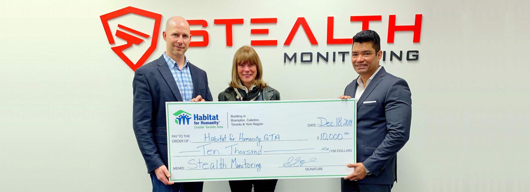 ECAM Presents Check to Habitat for Humanity hero scaled 1