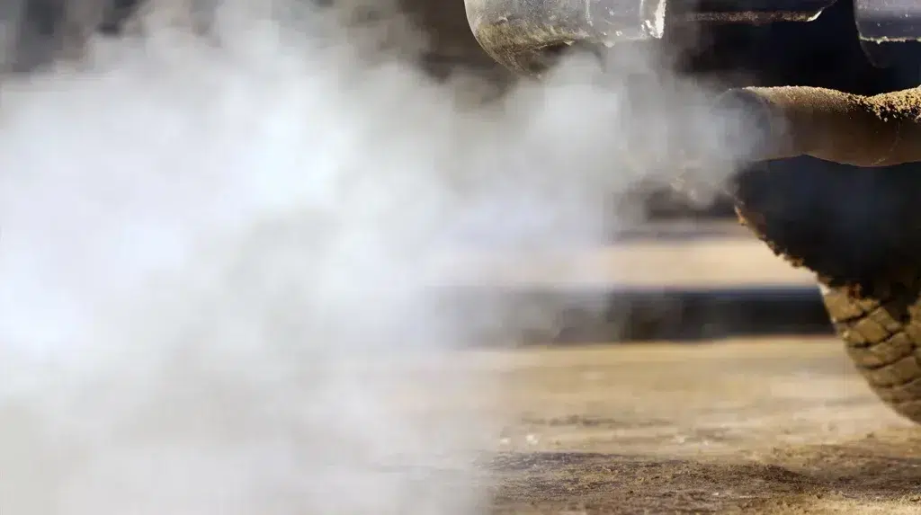 a smoke coming out of a car's exhaust