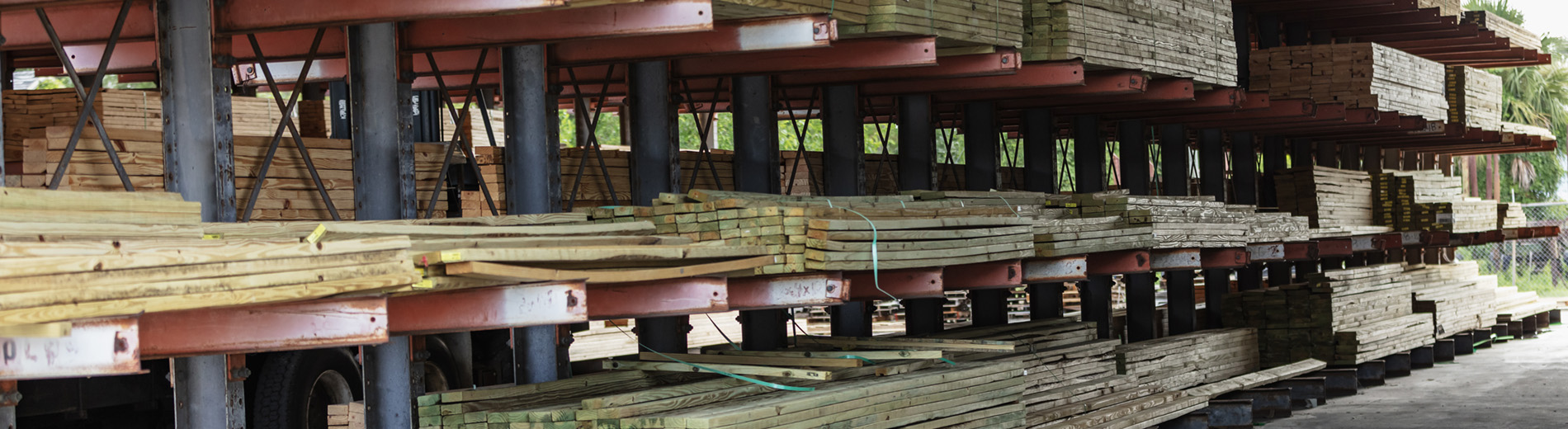 Stacks of lumber on shelves at lumberyard