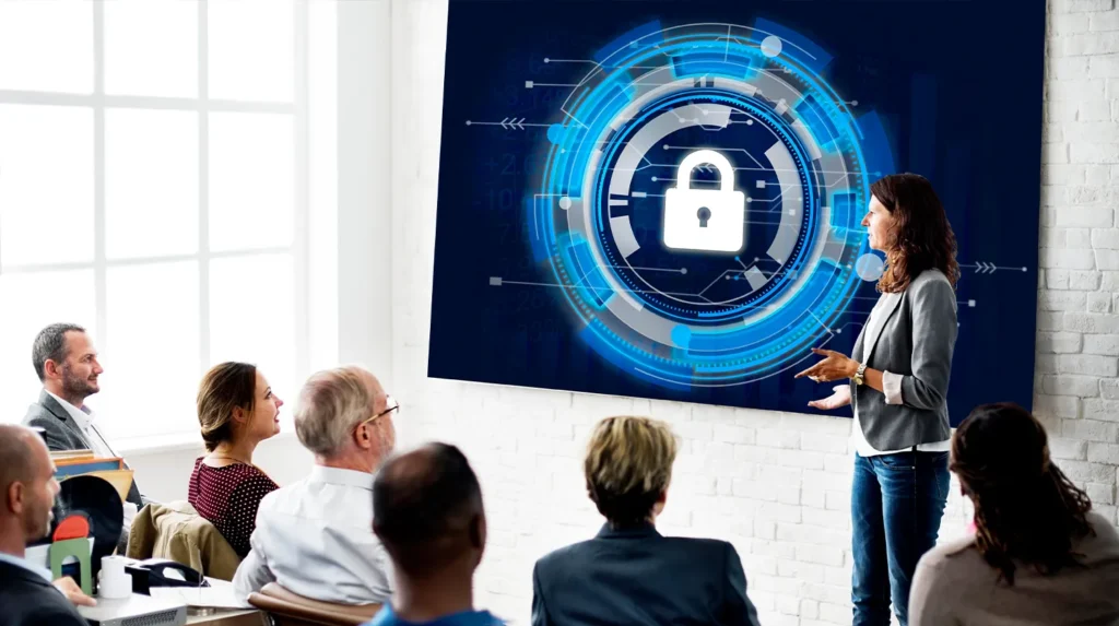 woman in front a graphic of a lock standing before a class
